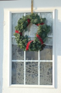 Wreath on frosty window by Bruce Stambaugh