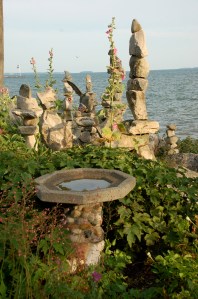 Lakeside rocks and flowers by Bruce Stambaugh