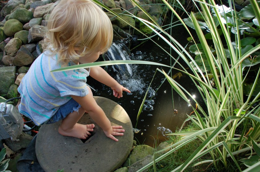 Girl on grindstone by Bruce Stambaugh