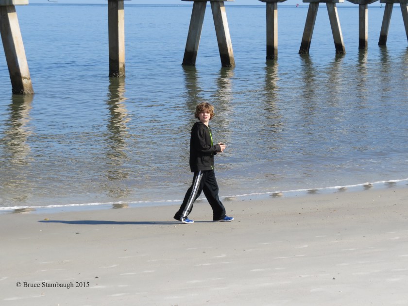 young boy, pier supports