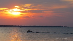 boat at sunset, wake