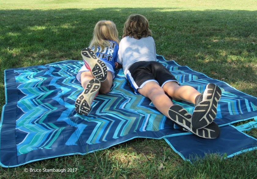 sister and brother, resting in the shade
