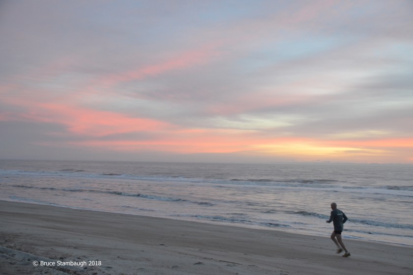 running on the beach, sunrise